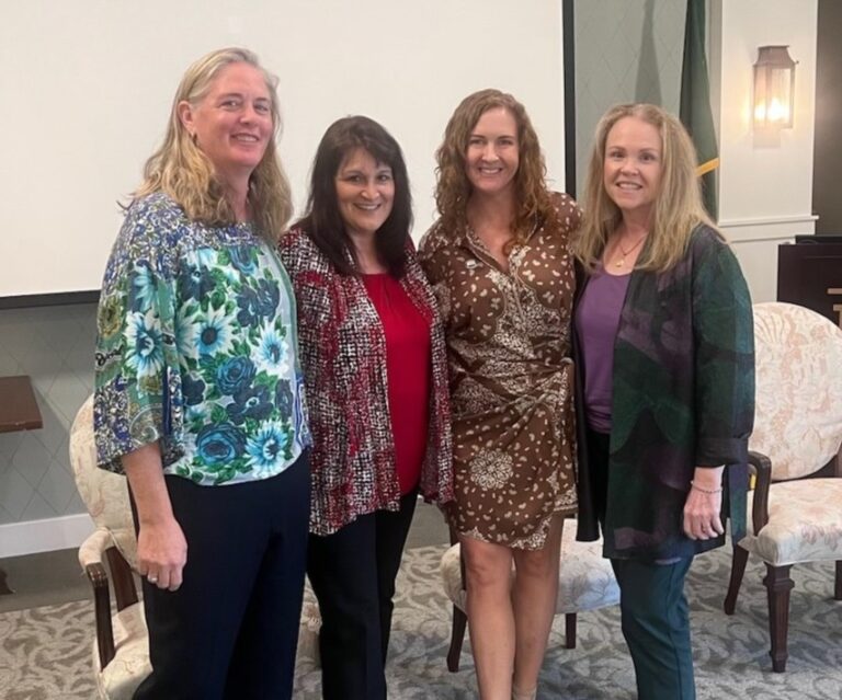 ServiceSource Assistant Project Manager Kathy Davis and Vice President of Operations Tina Herzik stand with Heather Dales, CEO of The Arc of Indian River County, at the Powered by Purpose Speaker Series in Vero Beach, Florida.