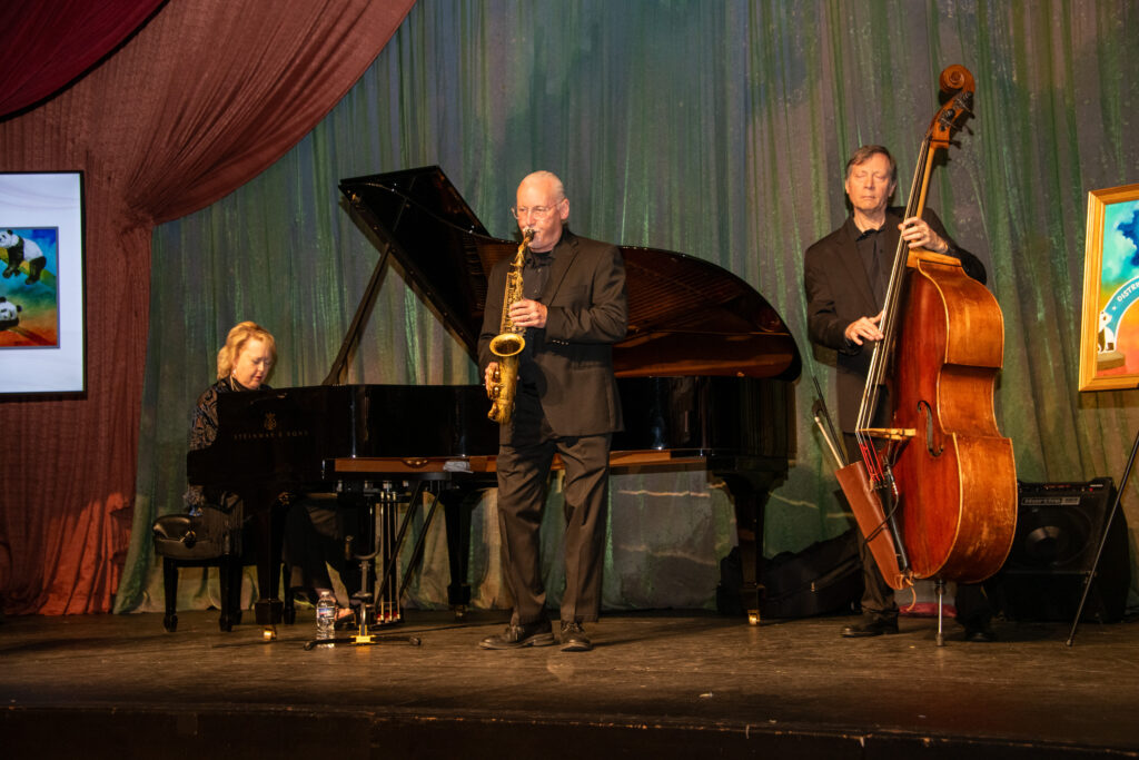 Jazz trio plays music on stage