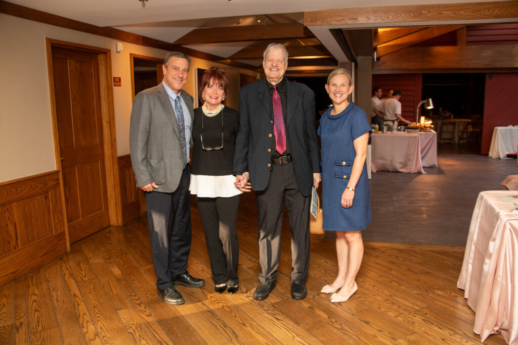 Two men and two women smile at the event